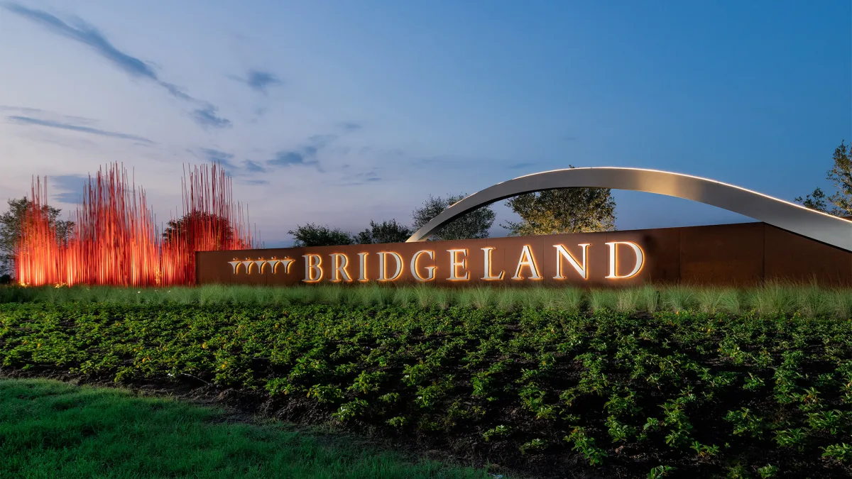 Bridgeland entrance sign at dusk